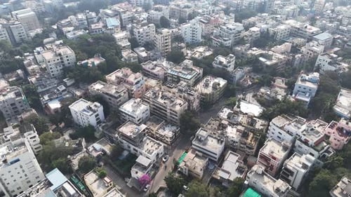 Aerial footage of Hyderabad in daylight, featuring a mix of commercial buildings, residential