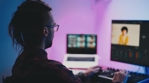 Man Working at Computer Video Editing