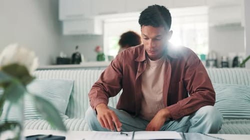 Stressed Young Adult Looking at Finances