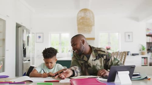Father and Son Drawing Together at Home
