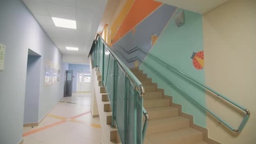 Bright School Hallway with Colorful Stairs
