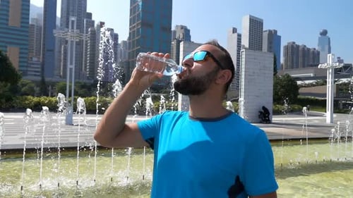 Young Jogger Drinking Water After Run, Super 240