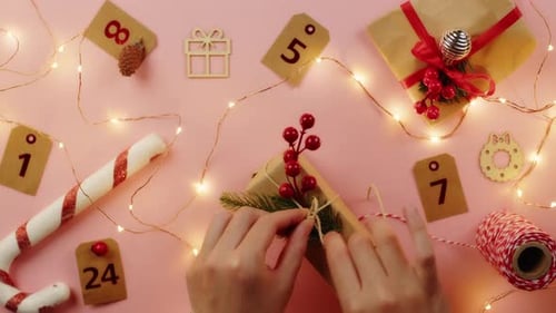 Hands Tying Christmas Gift with Twine
