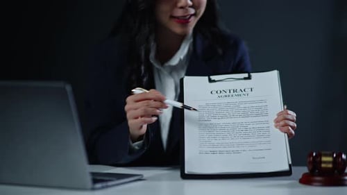 Woman Lawyer Explaining Contract Agreement in Office