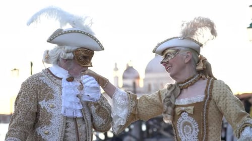 Senior Couple in Venetian Costumes Celebrating Carnival
