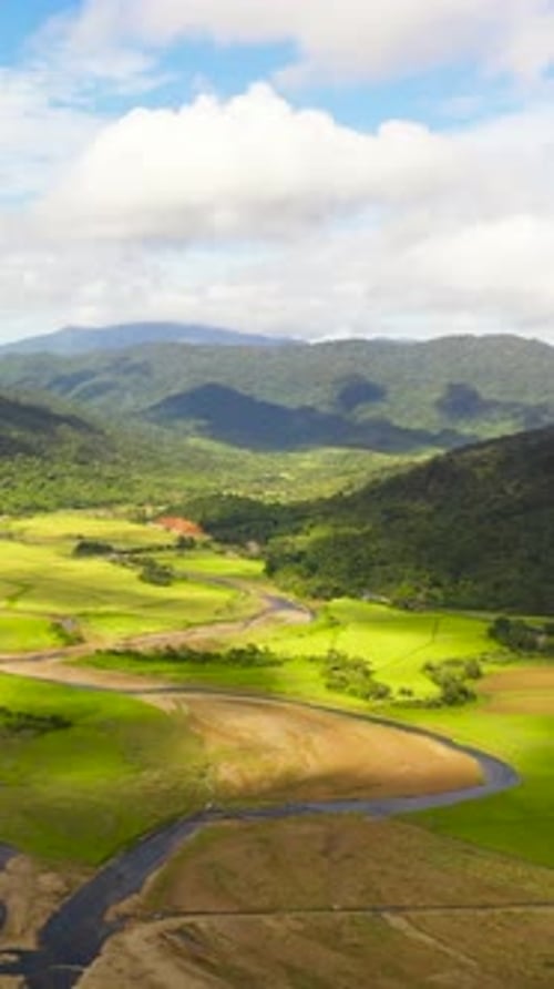 Lush Green Valley with River, Aerial View