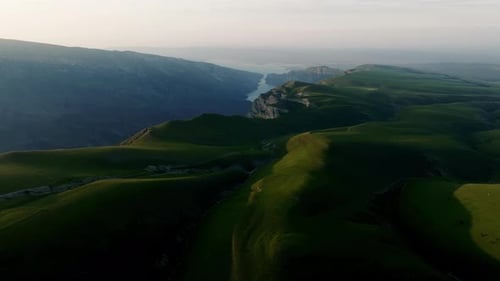 A Hilly Valley on Top of a Mountain Aerial Photography From a High Altitude A Canyon with a River