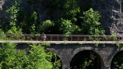 drone following a cyclist in the mountain