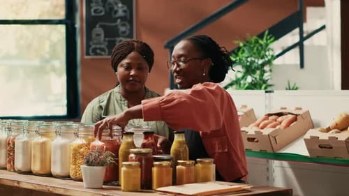 Adults Working Behind Counter in Natural Food Store