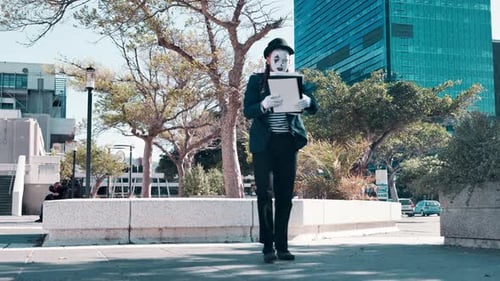 Man, walk and fall as street mime or performer with paper for circus and performance in downtown New