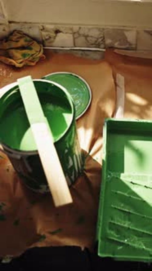 Above, paint and tools for renovation in home, improvement and interior design with maintenance