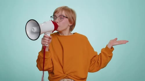 Woman Talking with Megaphone Proclaiming News Loudly Announcing Advertisement Pointing Empty Place