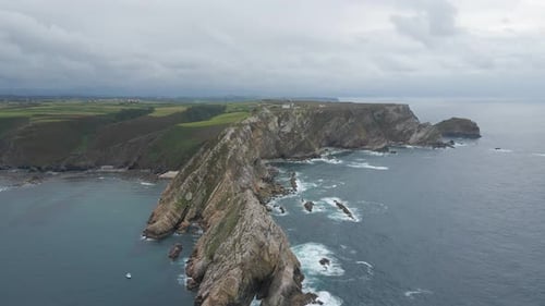 Aerial view of Asturias coastline. Drone shot of sea, cliff, rocks and the Atlantic ocean in Spain.
