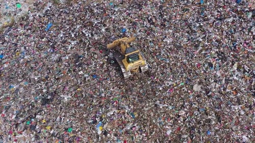 Aerial view of excavator working with trash on rubbish dump in Burgas, Bulgaria