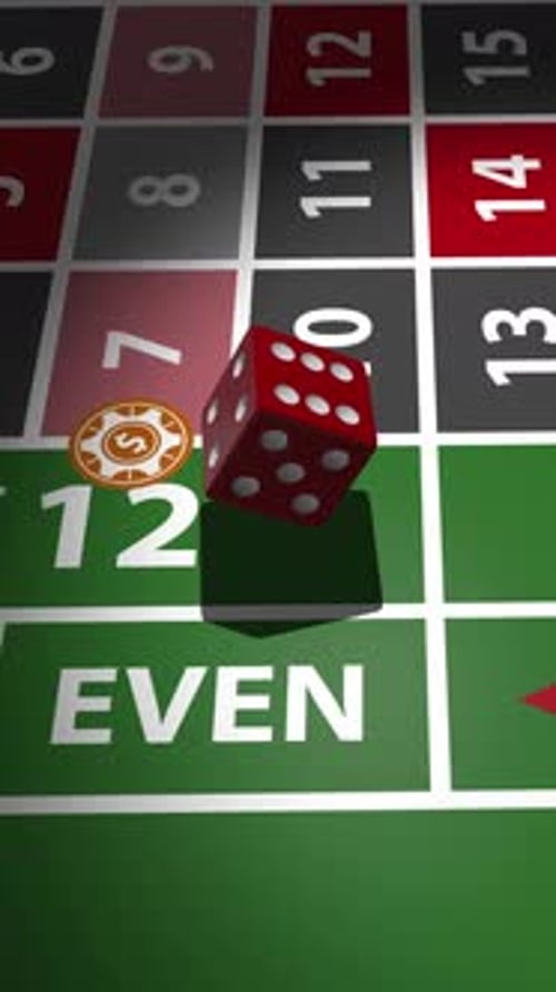 Red dice rolling on green roulette table with numbered betting grid.