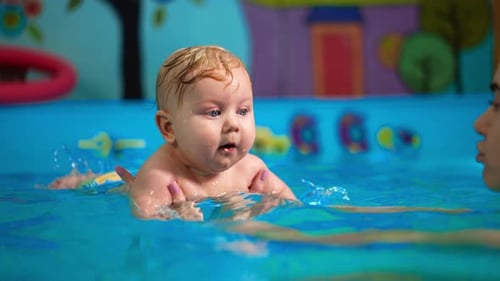 Infant Splashing and Swimming in a Small Pool