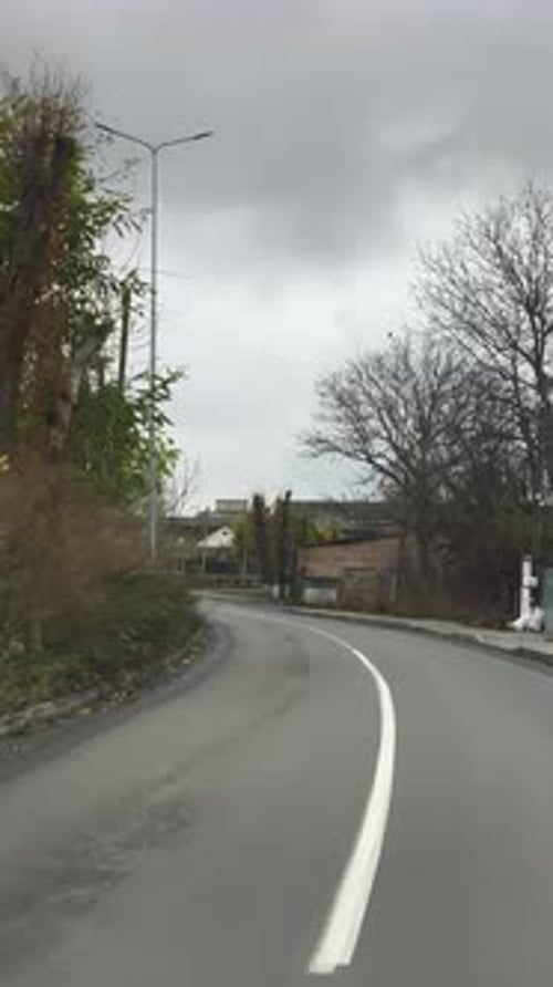 A view of a street with a white line on the side of it
