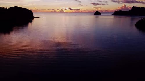 Panorama Of Sunset Over The Ocean And Tropical Beach During Summer. - aerial ascending shot