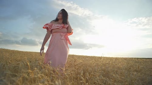 The Feeling of Freedom Alone with a Woman Walking Through a Wheat Field