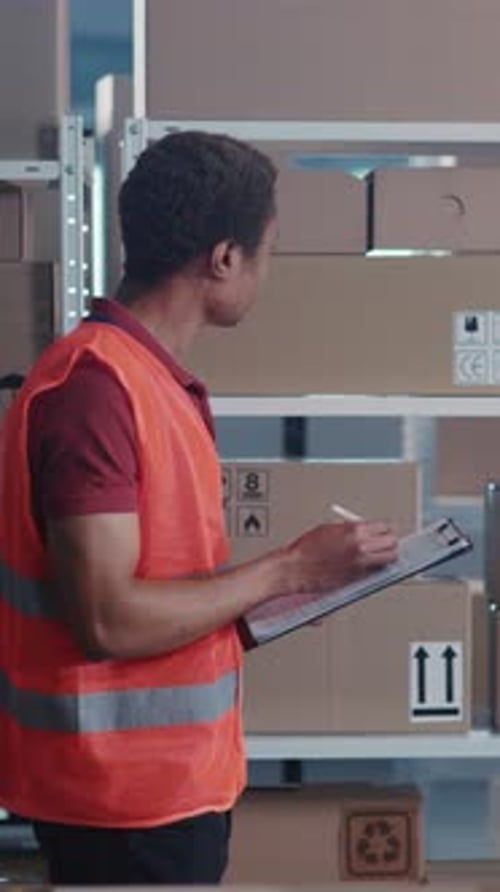 Warehouse Inventory Check With Adult Man and Manager
