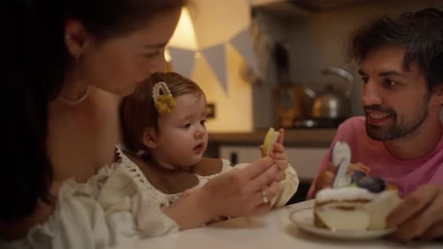 Family Celebrating Baby's Birthday Together at Home