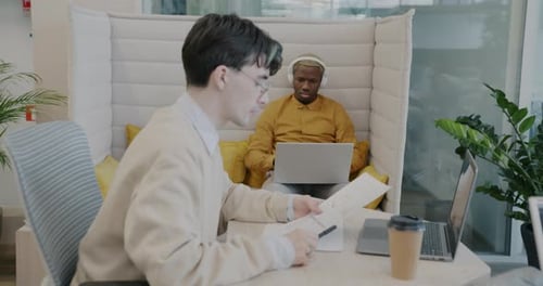 Diverse Team Working in Modern Collaborative Office