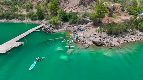 Aerial View Journey Through the Green Canyon on Paddleboards People Relax in the Summer Sun