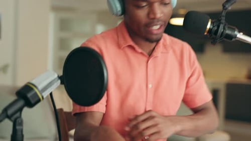 Young Adult Recording Podcast with Microphone