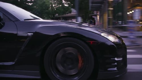 Portland, Oregon Circa-2018. Black Sports Card Driving on Street Auto