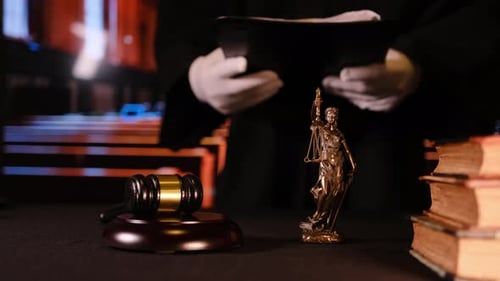 The Symbolic Representation of Justice Within a Courtroom Setting Includes the Presence of a Gavel