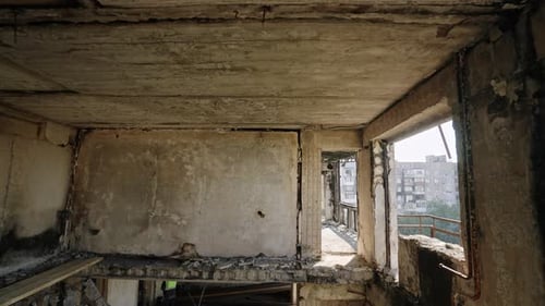 Burnt Apartment Shows Aftermath of War with Collapsed Ceilings Exposed Walls Residential Building