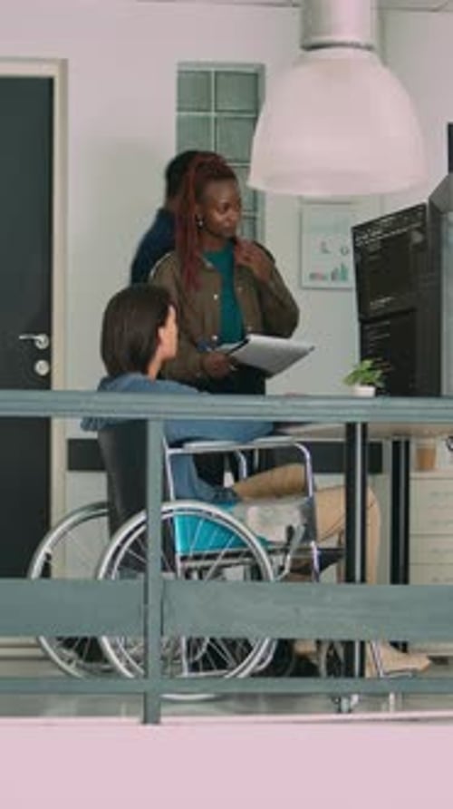 Vertical Video Multiethnic Group of Programmers Collaborating on It Project to Create Algorithm