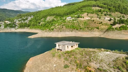 Aerial Video of an Old House and Bridge Around the Lake