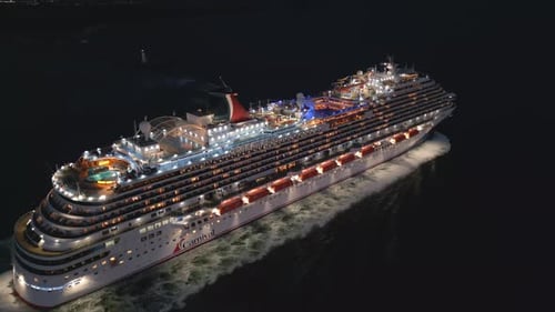 Cruise Ship Sailing across Ocean at Night