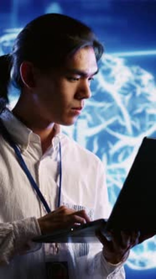 Young Adult Working with Futuristic Technology