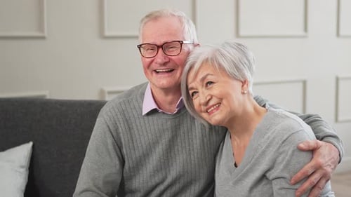 Senior Couple Embracing Warmly at Home