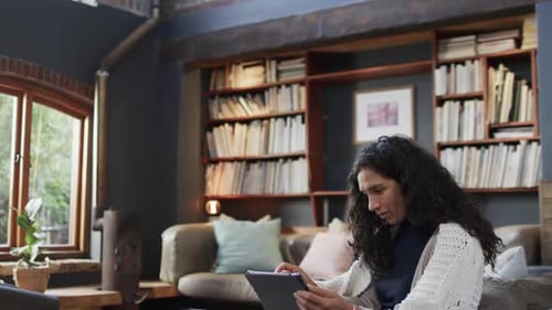 Woman Uses Tablet Device at Home