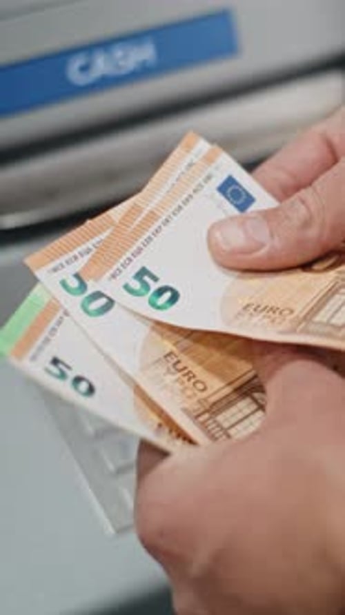 Close Up of Unrecognizable Man Counting Euro Bills After Withdrawing Cash Money
