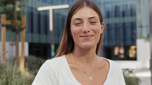 Young Blond Woman Smiling Looking to Camera Confident and Happy Portrait in Urban City