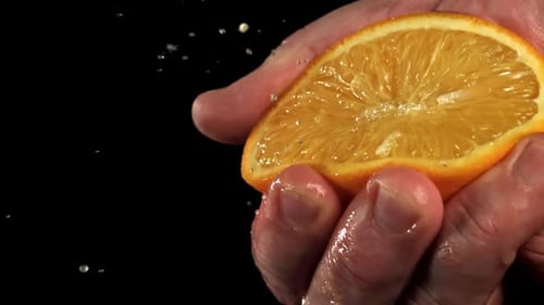 The Chef Squeezes Orange Juice Filmed on a Highspeed Camera at 1000 Fps