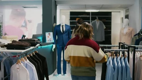 Woman Shopping with Assistance at Clothing Store