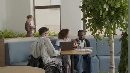 Diverse Group Working Together in a Modern Office