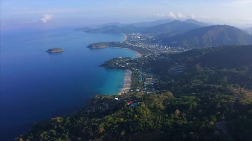 Aerial view of the tropical coastline with beaches and green lush forest. Phuket island, Thailand