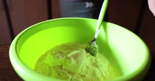 Cook Preparing Dough For Bread, Puts The Eggs Into Flour - high angle, close up