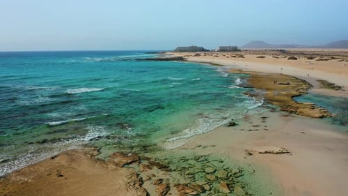 Turquoise Ocean and Sandy Beach Aerial View