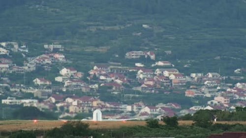 Slow Motion Video of the Plane Taking Off Against the Background of the City