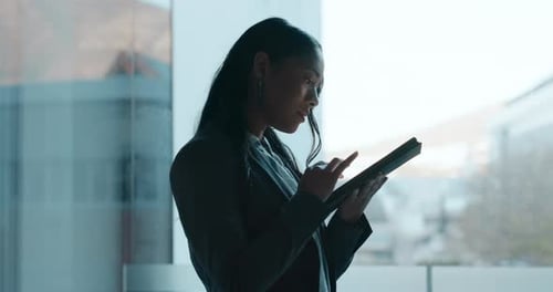 Woman Using Tablet Indoors