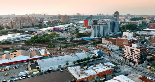 Construction site near the railways and busy roads. New York cityscape from top perspective.