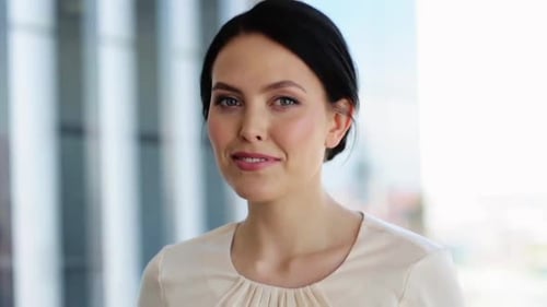 Business, People And Facial Expression Concept - Face Of Happy Smiling Young Woman At Office