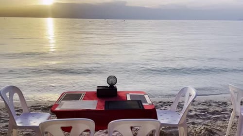 romantic sea view dinner table at sunset for couple lovers